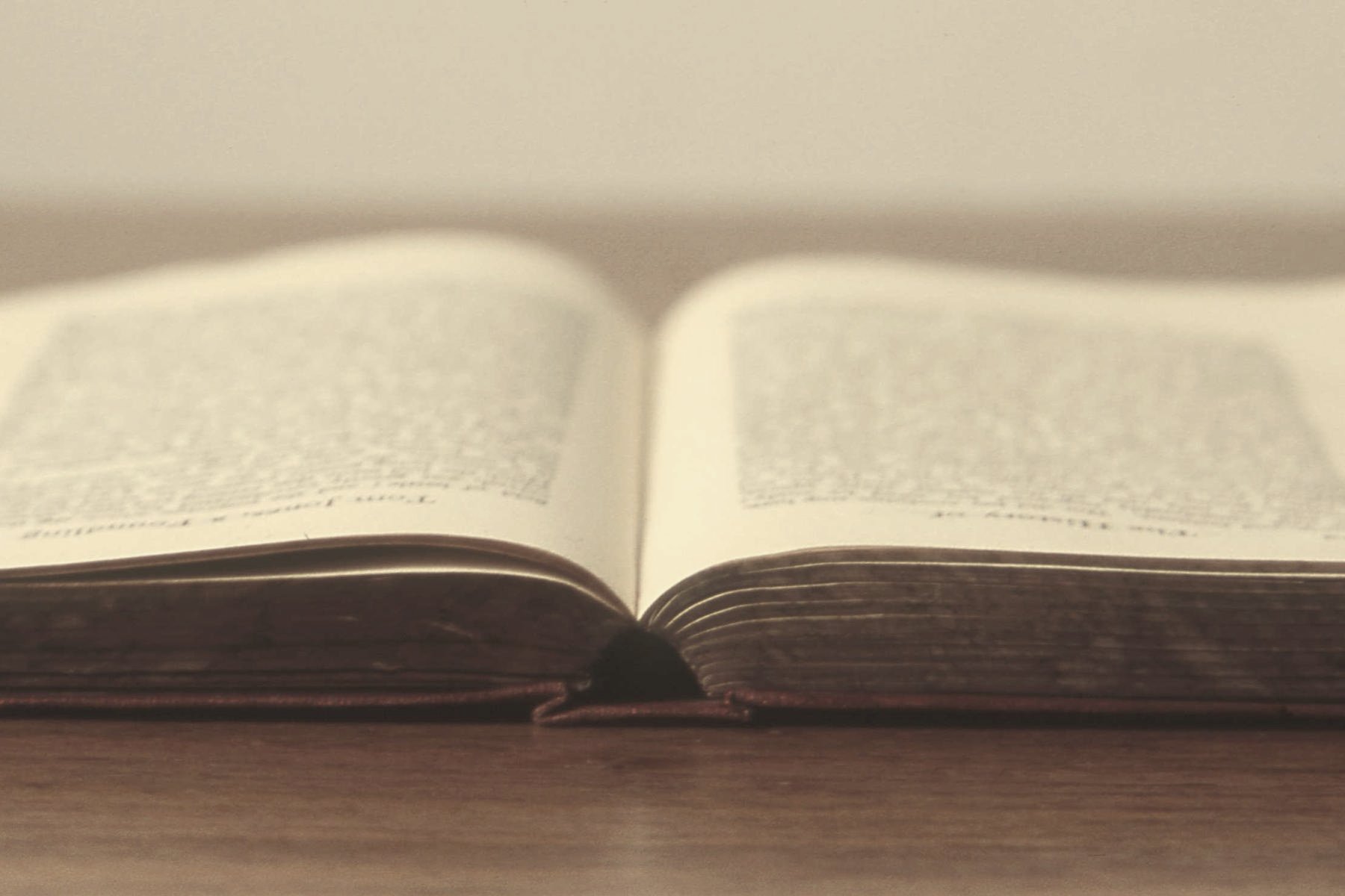 An open book on a wooden table